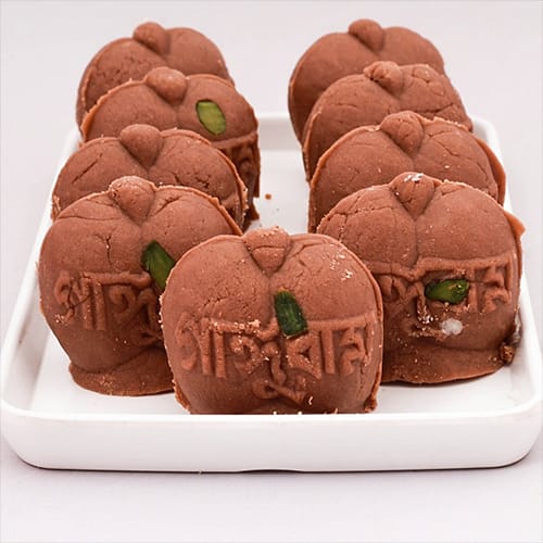 Bengali jolbhara sondesh serving in white plate
